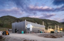 Concrete hydrogen facility in front of green hills