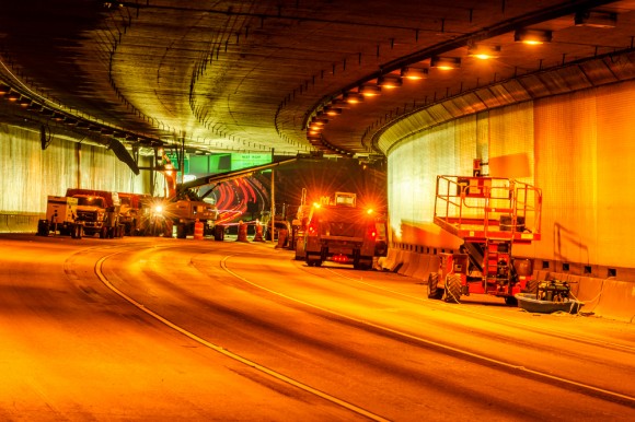 I-90 tunnel with work trucks