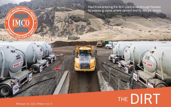 Priest Rapids Right Embankment Project - IMCO Construction White tank trucks lined outside of a yellow dump truck