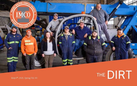IMCO Construction's Shop Team 2025 Team of shop staff posing on a blue crane in IMCO shop.