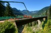 Construction crew performing a bridge deck pour at heights in North Bend with forest background