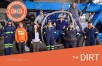 Team of shop staff posing on a blue crane in IMCO shop.