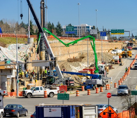 Construction site with congested traffic with roadway in background