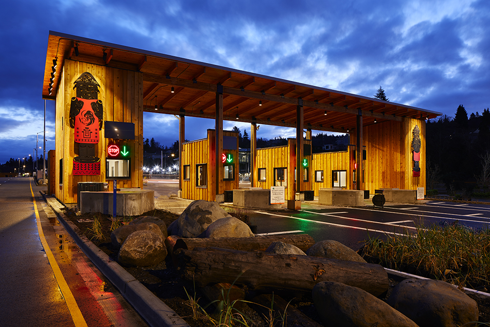 toll booths in dramatic dusk lighting with native American artwork