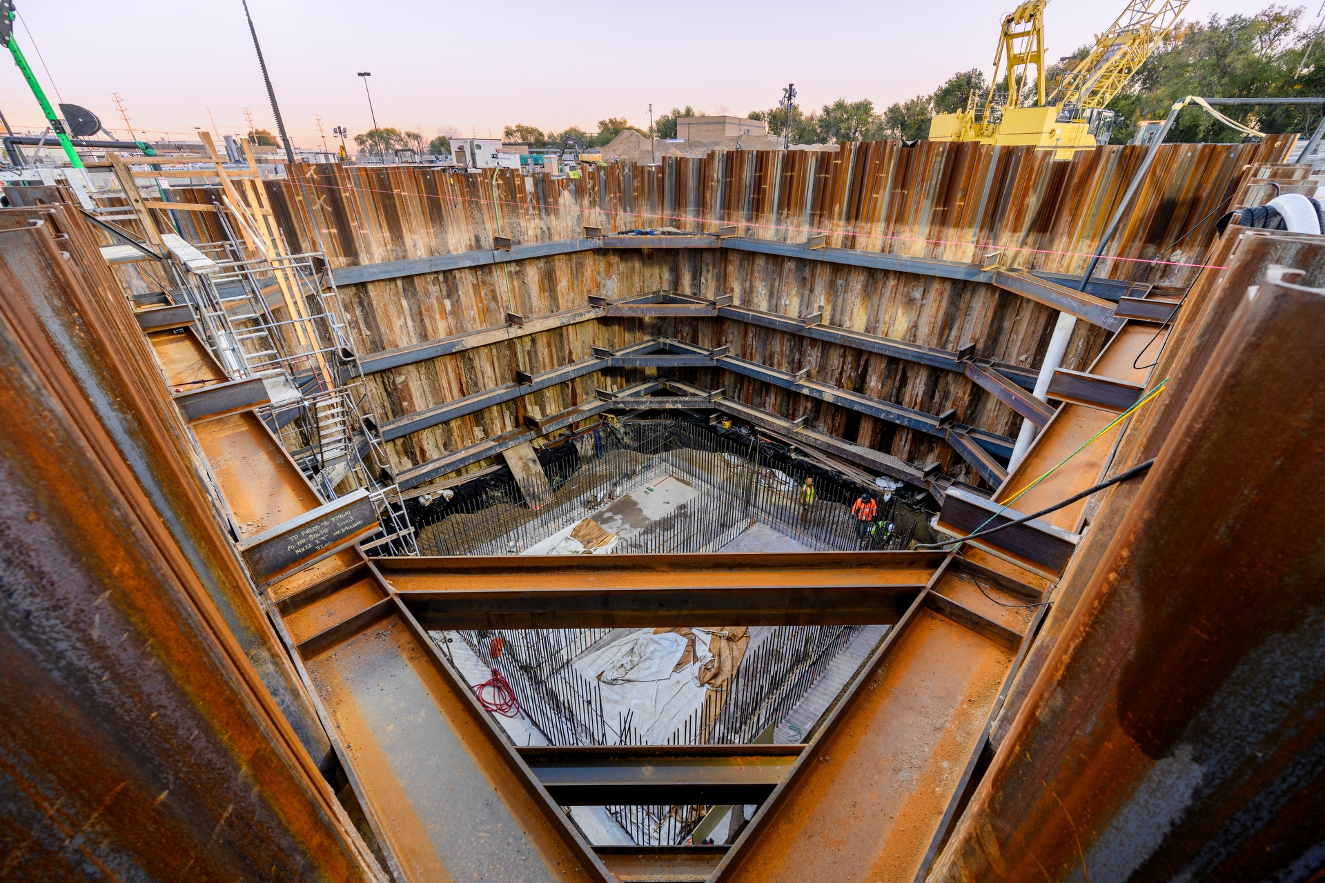 steel framed worksite in deep hole in the ground